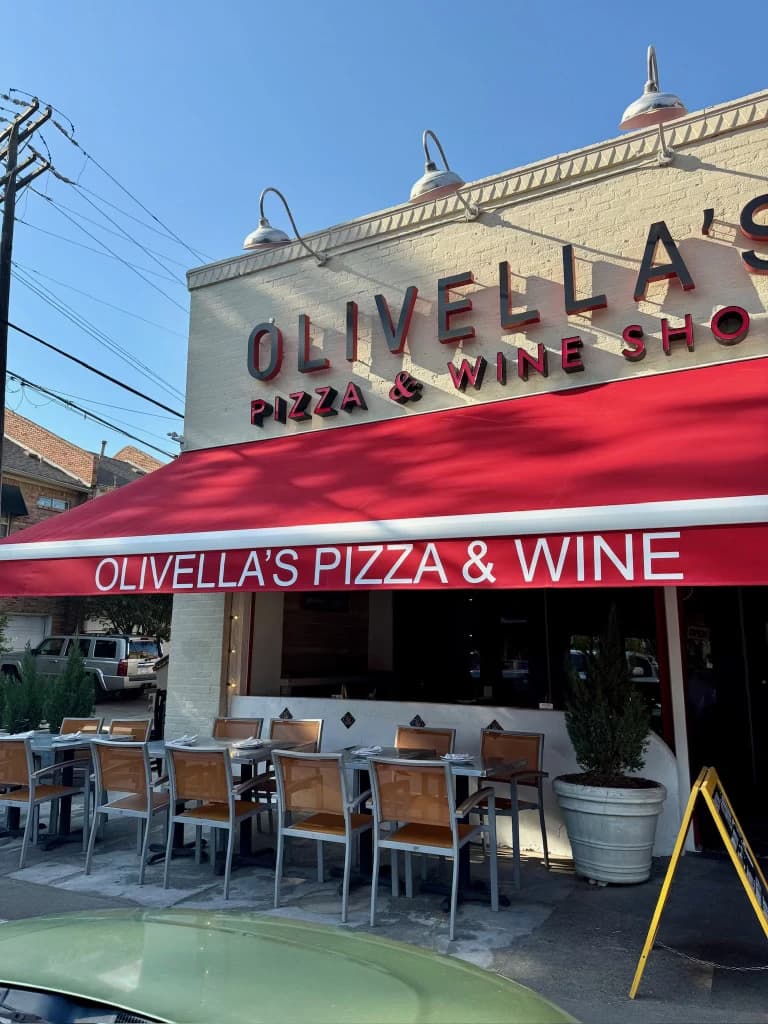 The Olivella's Pizza and Wine storefront with its red awning