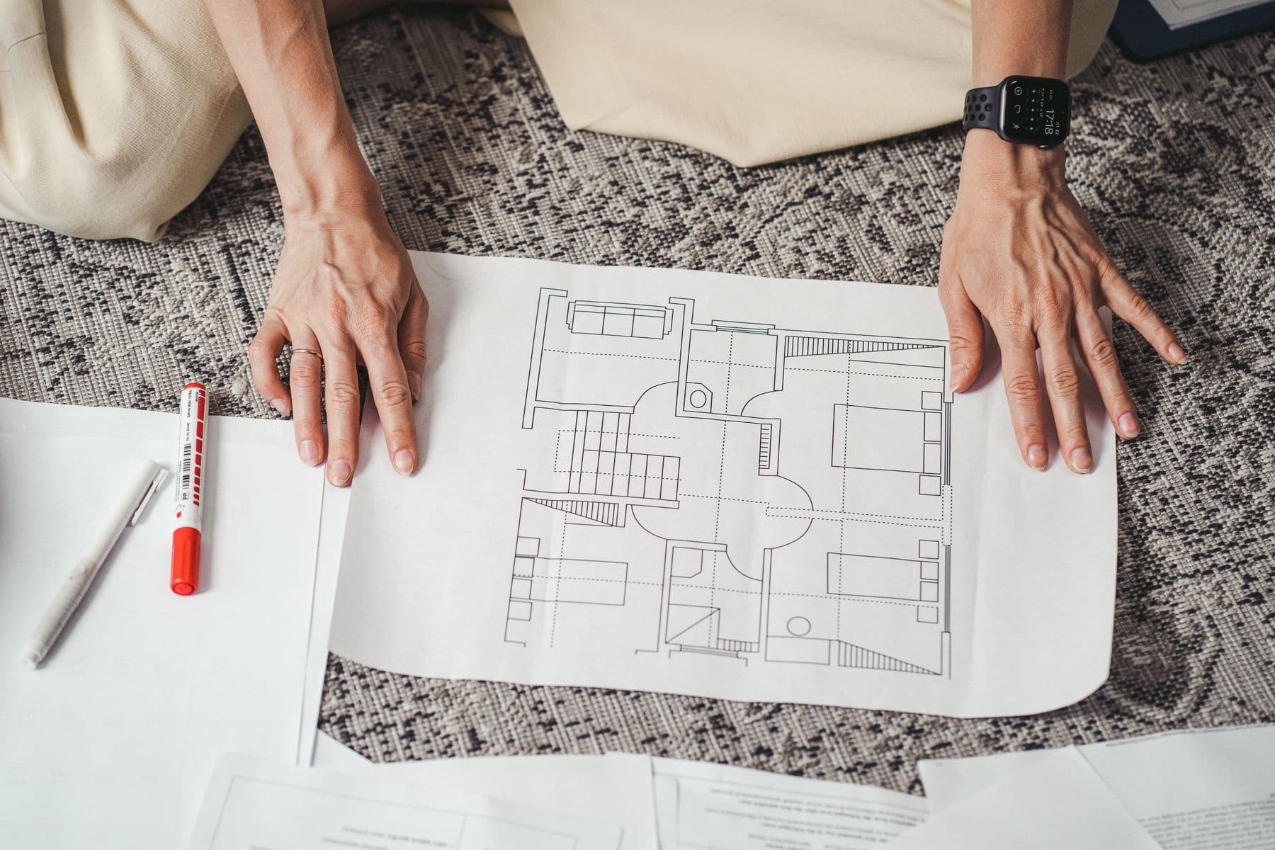 Hands on a restaurant floor plan